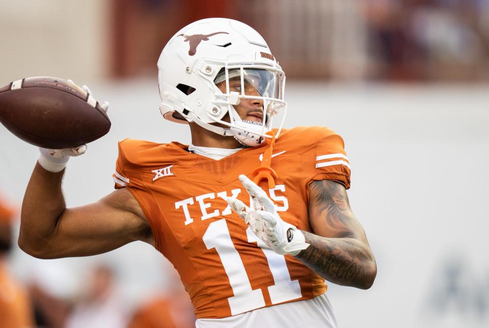 Texas wide receiver DeAndre Moore Jr. (11) warms up ahead of the Longhorns' game against the Wyoming Cowboys, Saturday, Sept. 16 at Darrell K Royal-Texas Memorial Stadium in Austin.