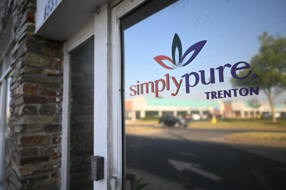 Storefront with logo that reads: Simply pure. Trenton