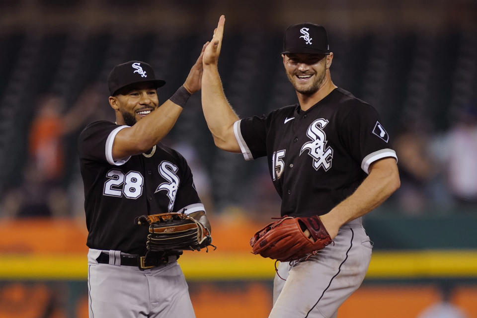 Chicago White Sox right fielder Leury Garcia (28) and center fielder Adam Engel (15) celebrate after the White Sox defeated the Detroit Tigers 5-4 in the 10th inning of a baseball game, Friday, June 11, 2021, in Detroit. (AP Photo/Carlos Osorio)