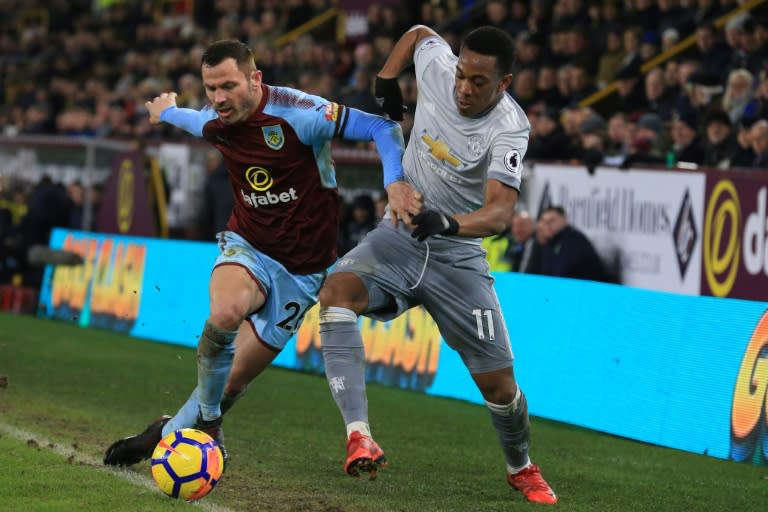 Manchester United's striker Anthony Martial (R) vies with Burnley's defender Phil Bardsley (L) during the English Premier League football match January 20, 2018