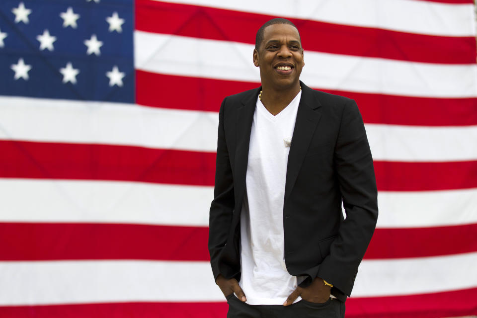 FILE - In this May 14, 2012 file photo, entertainer Shawn "Jay-Z" Carter smiles in between interviews, after a news conference at Philadelphia Museum of Art in Philadelphia. Pearl Jam, Skrillex, D'Angelo and more performers will take the stage at the Jay-Z-curated “Budweiser Made in America” music festival in Philadelphia this September. The festival will feature 28 acts at Philadelphia's Fairmount Park on Sept 1. and Sept. 2, which is Labor Day weekend. Tickets for the two-day festival go on sale Wednesday. (AP Photo/Matt Rourke, file)