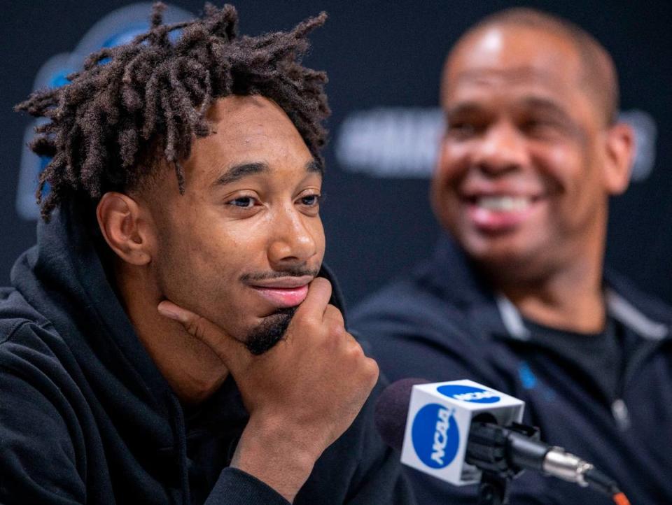 North Carolina’s Leaky Black (1) and coach Hubert Davis smile as they field questions during a media availability ahead of their NCAA East Regional final against Saint Peter’s on Saturday, March 26, 2022 at Wells Fargo Center in Philadelphia, Pa.