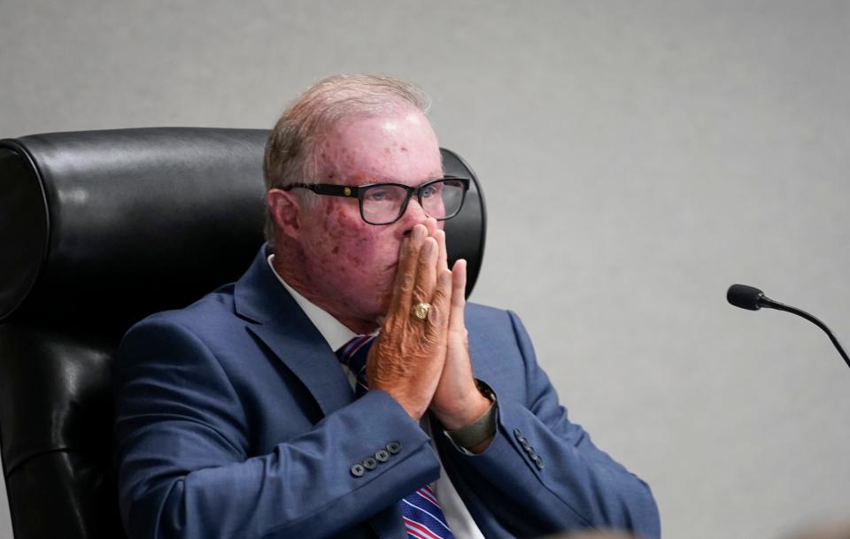 Collier County Commissioner Chris Hall listens to public comment on the “Collier County Health Freedom” ordinance he sponsored at the Collier County Administration building in Naples on Tuesday, March 28, 2023.
