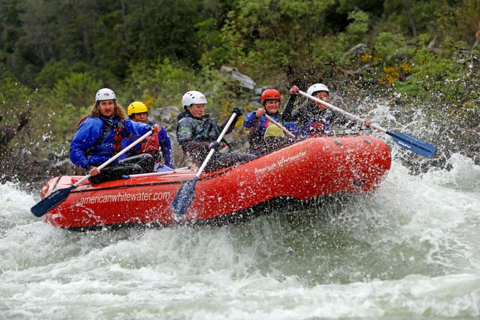 A guide trainee crew with American Whitewater Expeditions rafts down the south fork of the American River on Thursday, May 4, 2023, near Coloma.