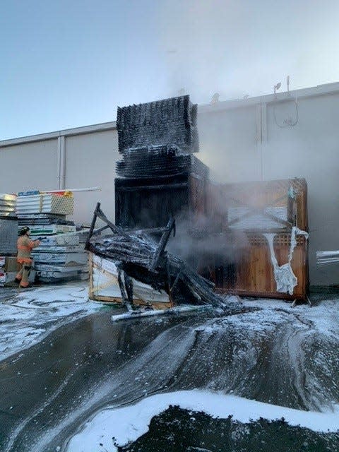 Salem Fire Department crews contain a pallet fire at the Lowe's on Turner Road SE to the rear of the home improvement store building.