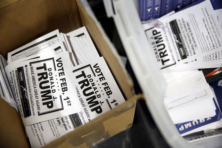 A box of flyers encouraging caucusing for U.S. Republican presidential candidate Donald Trump at a campaign rally at the University of Iowa in Iowa City, Iowa, January 26, 2016. REUTERS/Scott Morgan