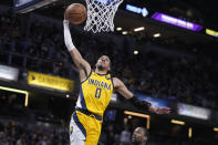 Indiana Pacers' Tyrese Haliburton goes up for a dunk during the second half of an NBA basketball game against the Sacramento Kings, Friday, Feb. 3, 2023, in Indianapolis. (AP Photo/Darron Cummings)