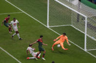 Portugal's Goncalo Ramos, second left, scores his side's third goal in front pf Switzerland's goalkeeper Yann Sommer during the World Cup round of 16 soccer match between Portugal and Switzerland, at the Lusail Stadium in Lusail, Qatar, on Tuesday, Dec. 6, 2022. (AP Photo/Ariel Schalit)