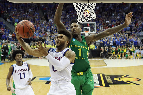 Kansas’ Frank Mason and Oregon’s Jordan Bell both likely improved their draft stocks this month. (Getty)