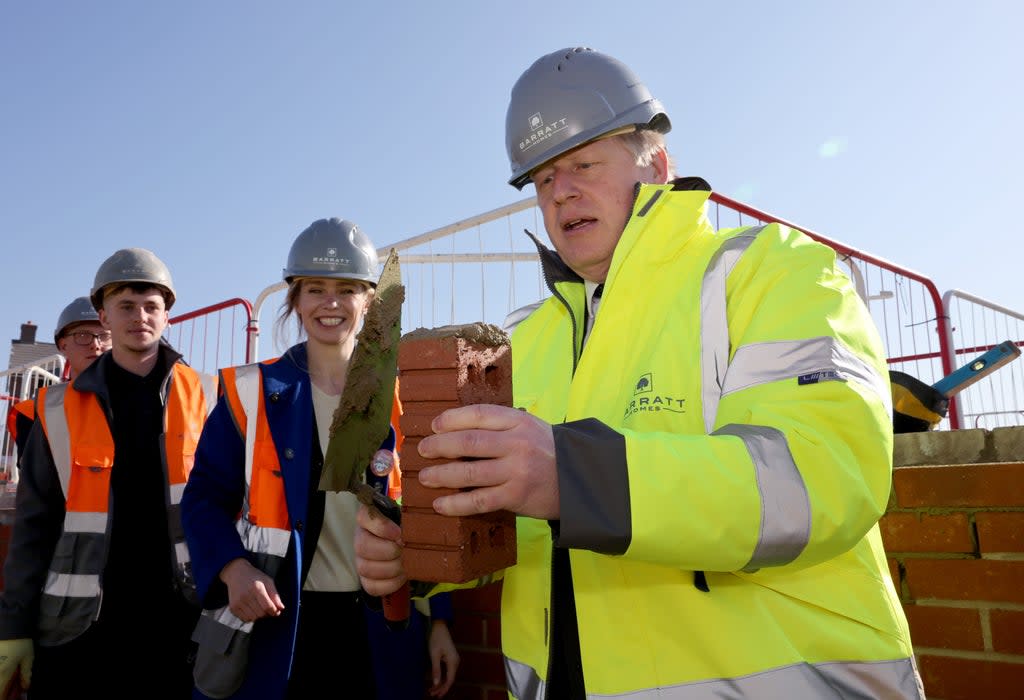 Stroud MP Siobhan Baillie (centre) with Prime Minister Boris Johnson during a visit to a Barratt Homes development site in Great Oldbury, Gloucestershire (PA) (PA Wire)