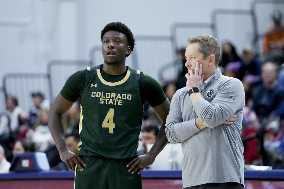 Colorado State guard Isaiah Stevens, left, speaks with coach Niko Medvedduring the second half of the team's NCAA college basketball game against Loyola Marymount on Friday, Dec. 22, 2023, in Los Angeles. (AP Photo/Ryan Sun)