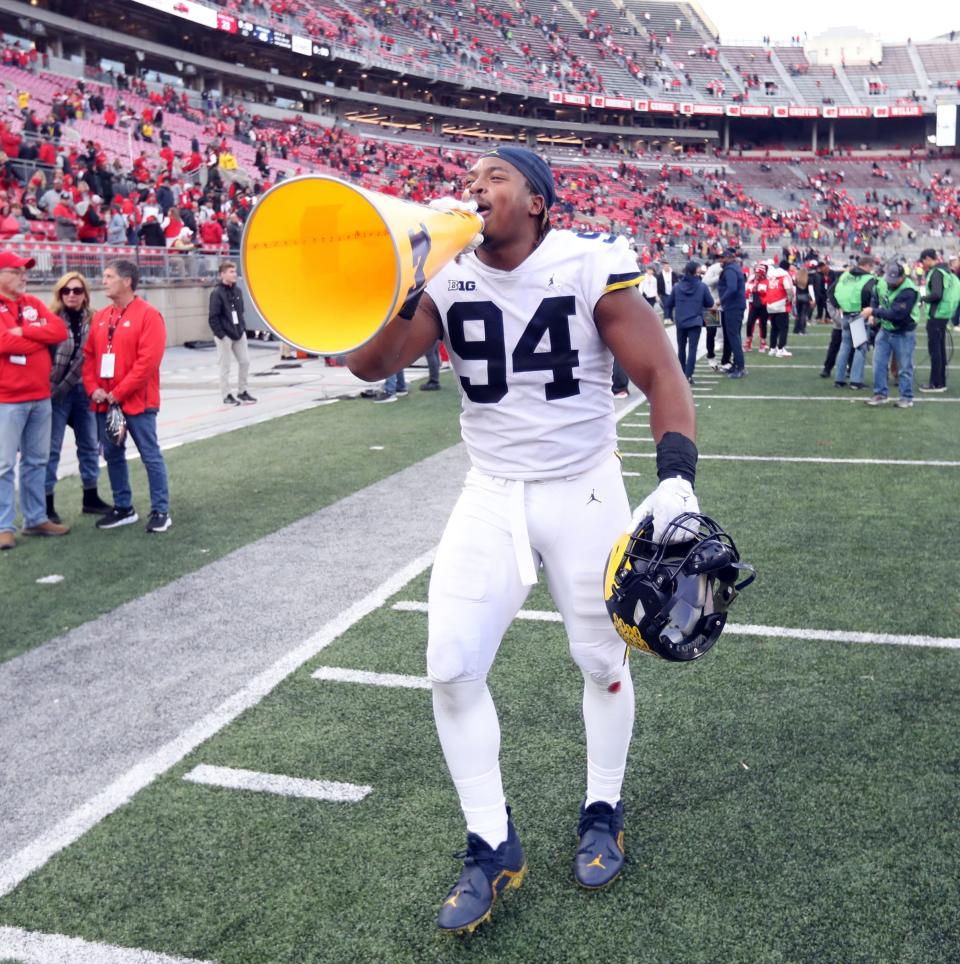 Michigan defensive lineman Kris Jenkins (94) walks off the field with a message for Buckeye fans after the 45-23 win against Ohio State on Nov. 26, 2022 at Ohio Stadium in Columbus.