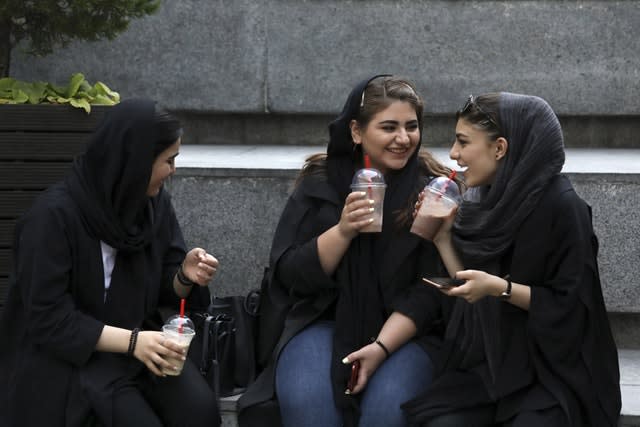 Youngsters outside a shopping centre in northern Tehran