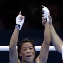 India's Chungneijang Mery Kom Hmangte celebrates after defeating Tunisia's Maroua Rahali in a women's flyweight 51-kg quarterfinal boxing match at the 2012 Summer Olympics, Monday, Aug. 6, 2012, in London. (AP Photo/Mike Groll)