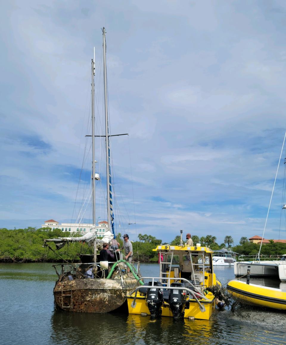Crews in September 2023 remove the sailboat Blue Moon from the Intracoastal Waterway in Jupiter. The town had received complaints for months about the vessel, which began to take on water in that April and sank to the sea floor in May.
