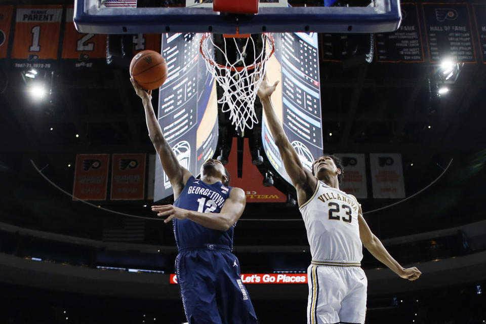 Georgetown's Terrell Allen, left, goes up for a shot against Villanova's Jermaine Samuels during the first half of an NCAA college basketball game, Saturday, Jan. 11, 2020, in Philadelphia. (AP Photo/Matt Slocum)