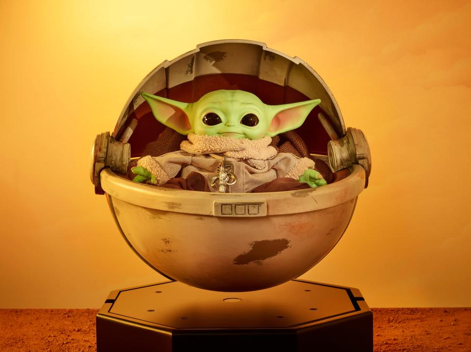 You can bid on the Mattel Creations toy, called "The Mandalorian The Child" in Floating Hover Pram, which includes a Child plush toy within and spins and levitates 2½ inches off the base.