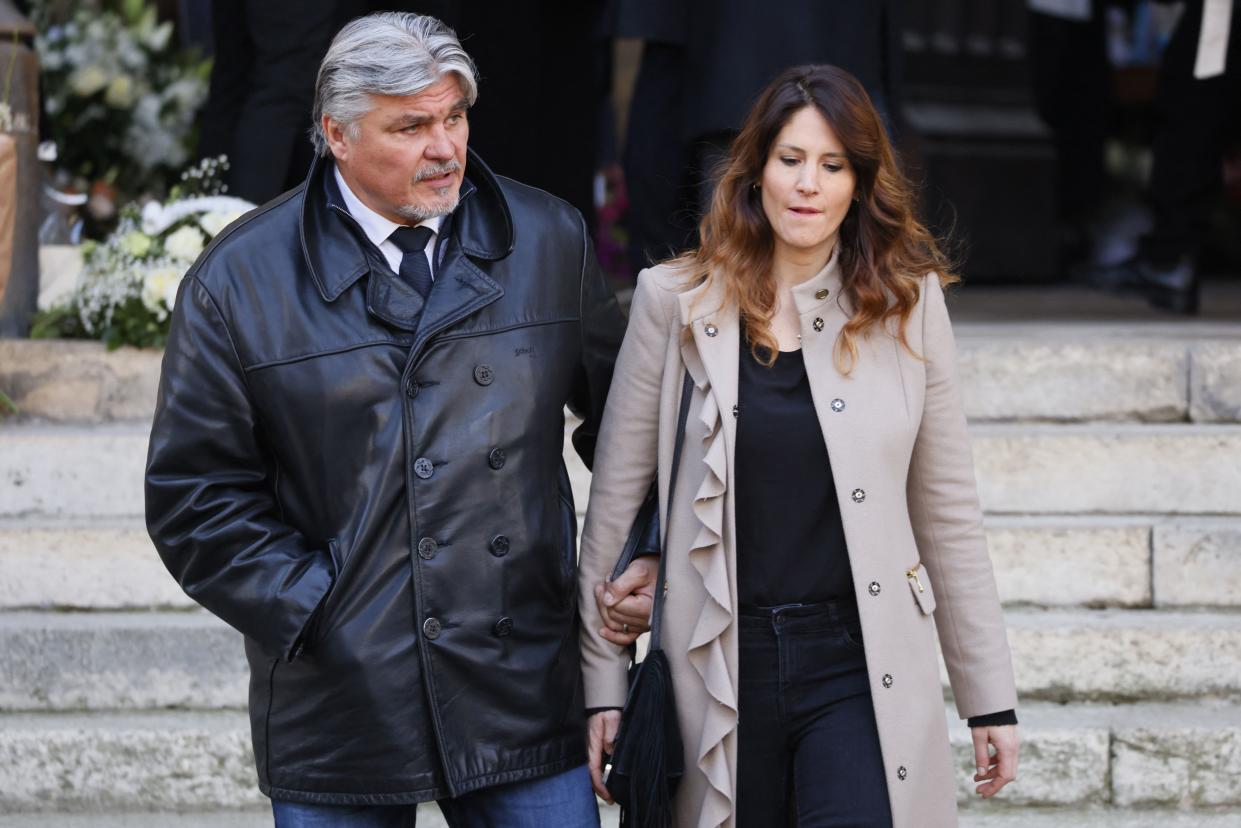 French former Sports Minister and judoka David Douillet (L) and his partner Vanessa leave Sainte-Clothilde basilica following the funeral ceremony of French journalist Jean-Pierre Pernaut in Paris, on March 9, 2022. (Photo by Thomas SAMSON / AFP) (Photo by THOMAS SAMSON/AFP via Getty Images)