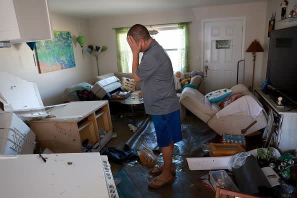 FORT MYERS, FLORIDA - SEPTEMBER 30: Brian Siebert becomes emotional as he looks at what remains of his home after Hurricane Ian passed through the area on September 30, 2022 in Fort Myers, Florida.  Mr. Siebert feels like he has lost everything in the apartment because there was about 6 feet of water that inundated it. The hurricane brought high winds, storm surges and rain to the area causing severe damage. (Photo by Joe Raedle/Getty Images)