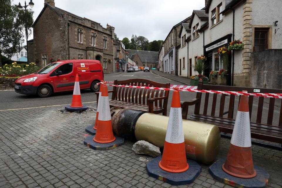 The golden postbox was knocked out of the ground when it was hit by a car last night (PA)