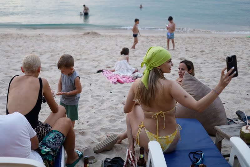 Russian tourists enjoy at Layan beach in Phuket