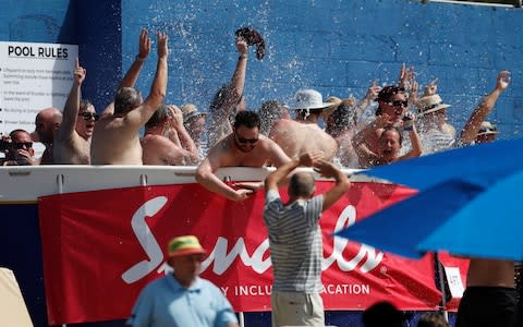 England fans slash about in a pitch-side pool  - Credit: action images