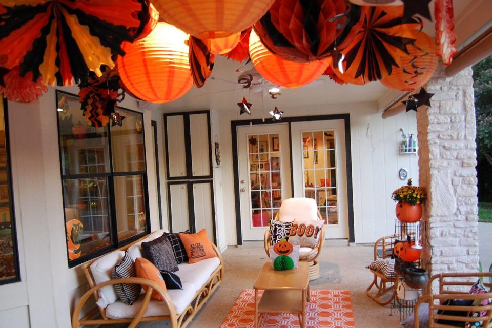 <p>An array of festive lanterns will create a warm and welcoming effect for guests.</p><p><strong><a href="https://www.countryliving.com/home-design/decorating-ideas/g4855/halloween-decorating-ideas-jennifer-perkins/" rel="nofollow noopener" target="_blank" data-ylk="slk:Get the tutorial;elm:context_link;itc:0;sec:content-canvas" class="link ">Get the tutorial</a>.</strong> </p>