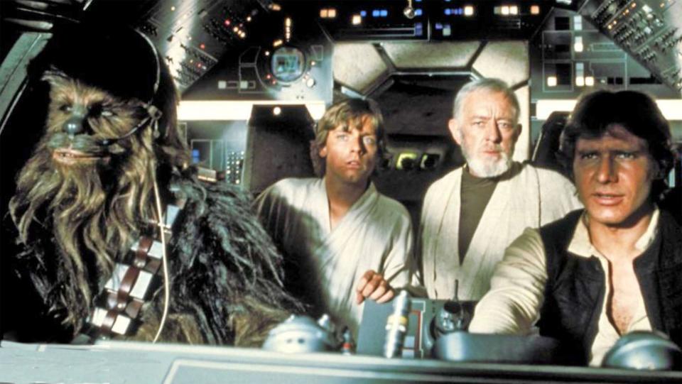 STAR WARS  1977  20th Century Fox film with from left: Peter Mayhew as Chewbacca, Mark Hamill as Luke Skywalker, Alec Guiness as Obi-Wan Kenobi, Harrison Ford as Han Solo