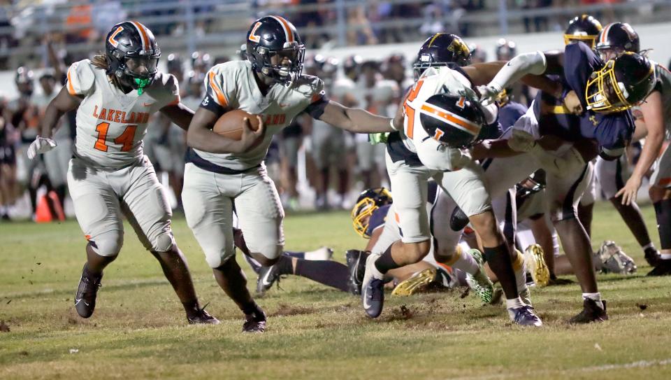 Lakeland's Malik Morris rushes for a 6-yard touchdown run against Winter Haven late in the second quarter on Friday night at Denison Stadium.