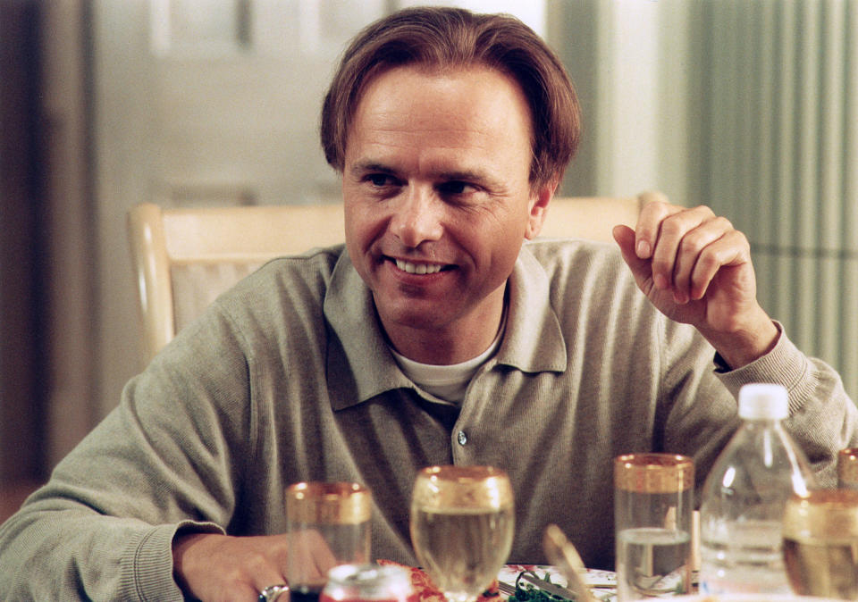 Joe Pantoliano as Ralph smiling at a dinner