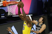 Los Angeles Lakers' Dwight Howard (39) is fouled by Sacramento Kings' Nemanja Bjelica (88) during the second quarter of an NBA basketball game Thursday, Aug. 13, 2020, in Lake Buena Vista, Fla. (Kevin C. Cox/Pool Photo via AP)