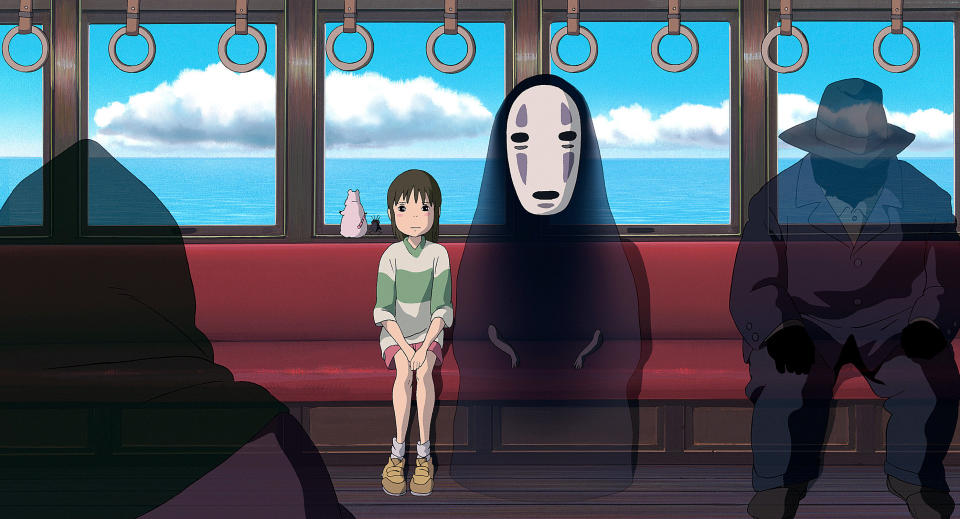 a child sitting on a ferry with ghosts