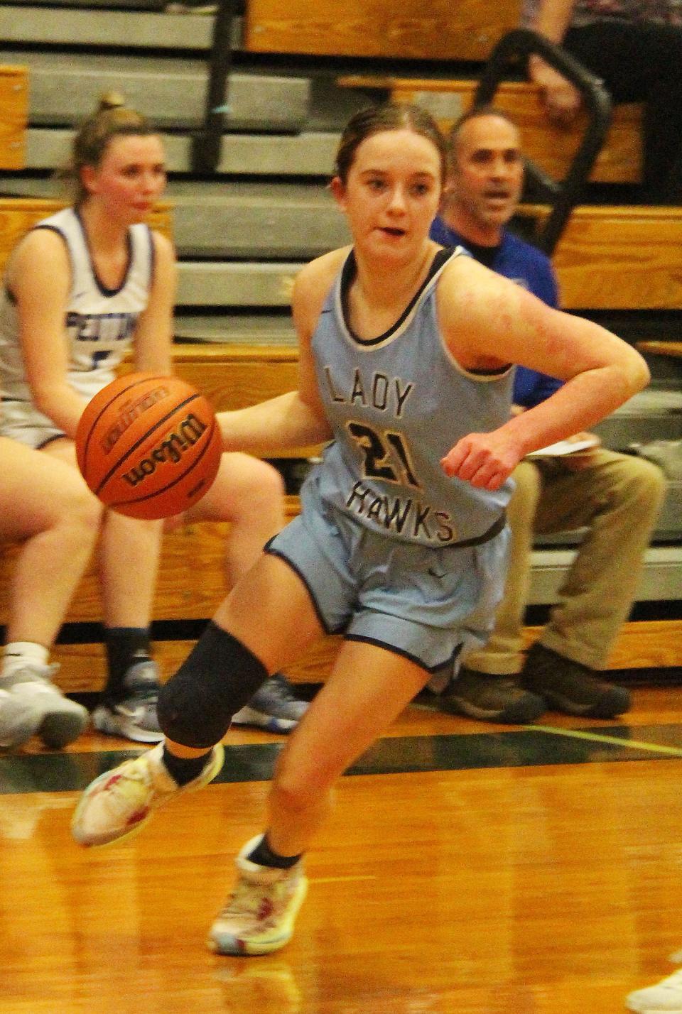 Mariya Sisco drives to the basket for Prairie Central in its regional final against Peotone. The Hawks lost to end their season at 20-8.