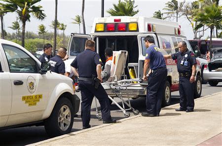 A 16-year-old boy is carried on a stretcher in Maui, Hawaii, April 20, 2014, as seen in this handout photo courtesy of Chris Sugidono,The Maui News. REUTERS/Chris Sugidono/The Maui News/Handout via Reuters