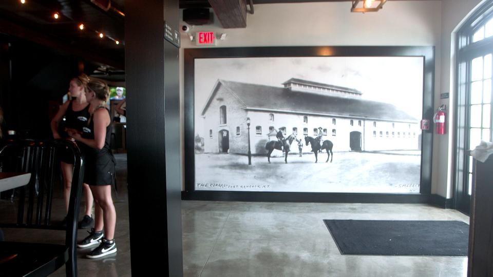 A large picture of the original mule barn hangs on the wall of the new Mule Barn Tavern in Sandy Hook.