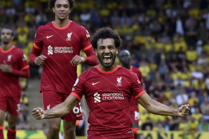 Liverpool's Mohamed Salah celebrates after scoring his side's third goal during the English Premier League soccer match between Norwich City and Liverpool at Carrow Road Stadium in Norwich, England, Saturday, Aug. 14, 2021. (AP photo/Rui Vieira)