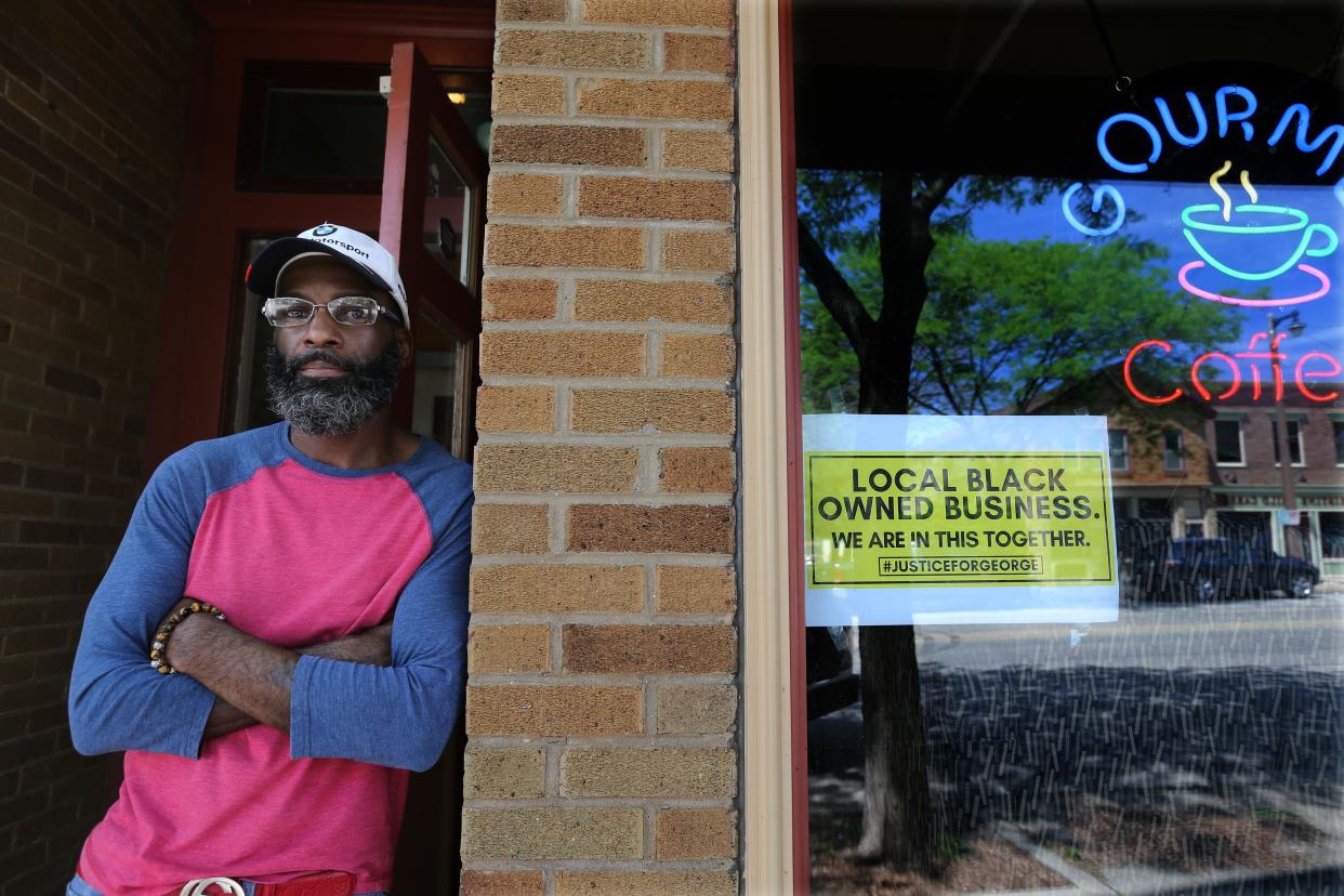 Paul Whigham, owner of Mi Casa Su Cafe at 1835 N. Martin Luther King Drive with George Floyd support sign in his business window on Wednesday, June 3, 2020.