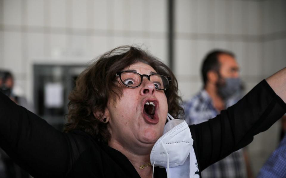 Pavlos Fyssas's mother celebrates the verdict - ALKIS KONSTANTINIDIS /REUTERS