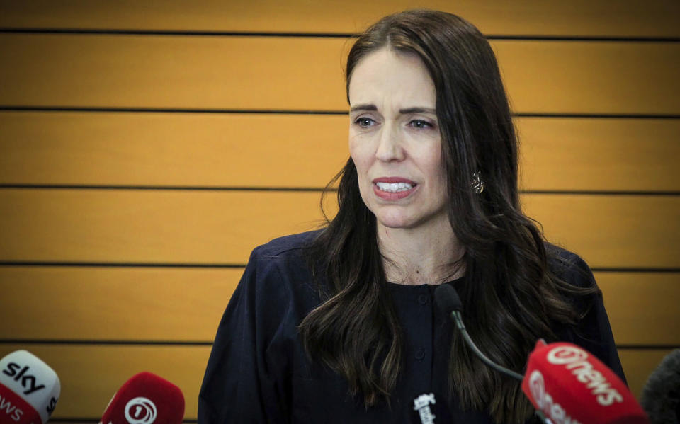New Zealand Prime Minister Jacinda Ardern grimaces as she announces her resignation at a press conference in Napier, New Zealand. Fighting back tears, Ardern told reporters that Feb. 7 will be her last day in office. (Warren Buckland/New Zealand Herald via AP)