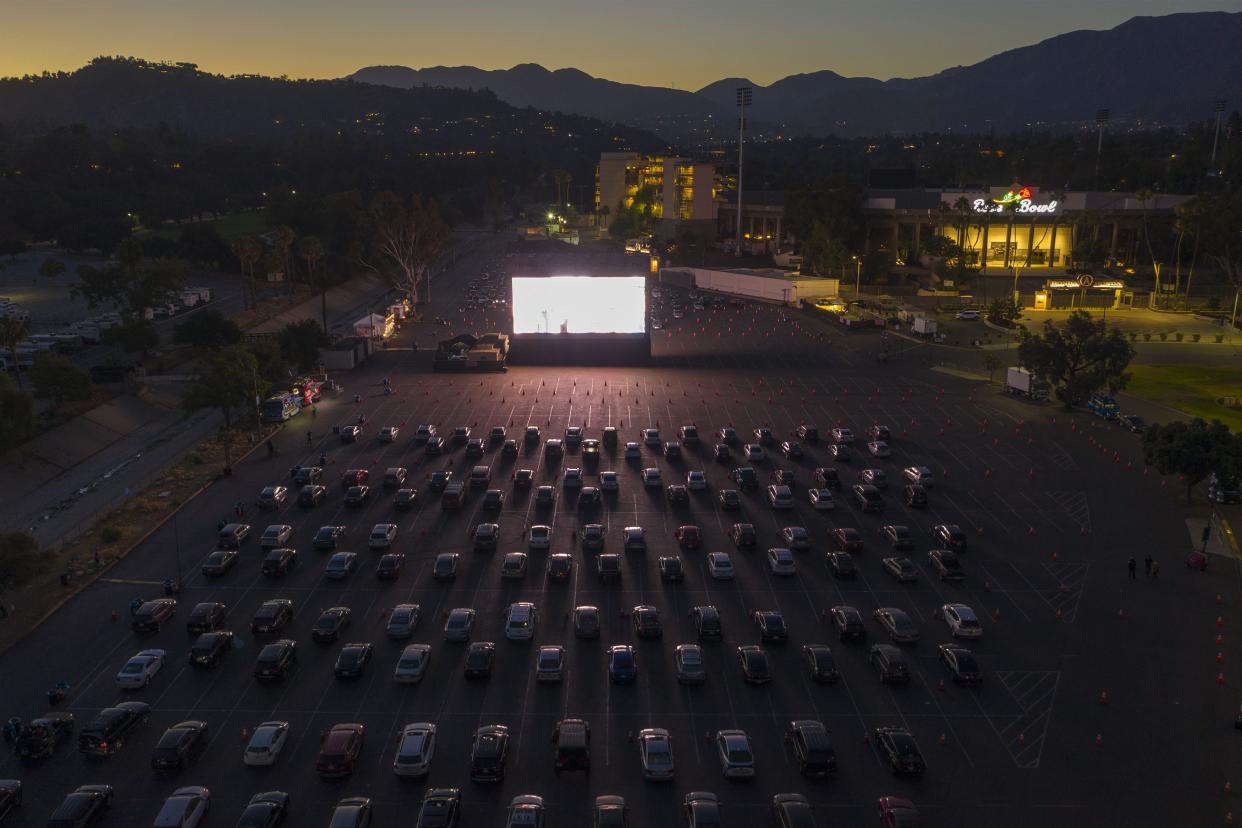 An aerial drone view shows a temporary drive-in movie theater at the Rose Bowl stadium, known for its Fourth of July fireworks, which were canceled this year to reduce large public gatherings due to COVID-19 concerns on July 4, 2020 in Pasadena, Calif. The Tribeca Drive-In is a monthlong temporary drive-in theater next to the Rose Bowl.