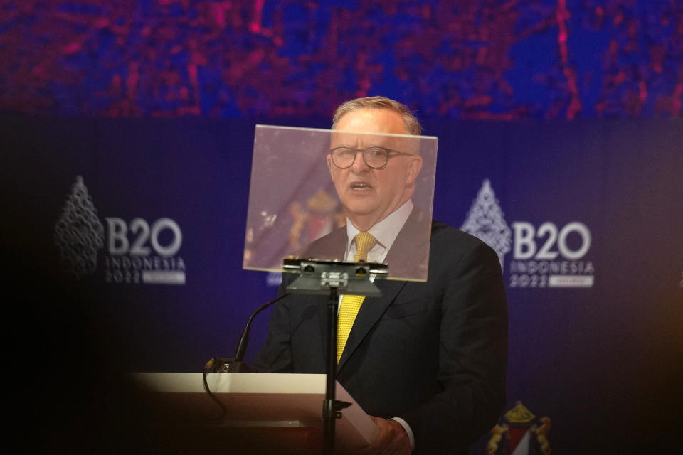 Australian Prime Minister Anthony Albanese is seen behind a projector as he speaks during the B20 Summit ahead of the G20 leaders summit in Nusa Dua, Bali, Indonesia, Monday, Nov. 14, 2022. (AP Photo/Aaron Favila)