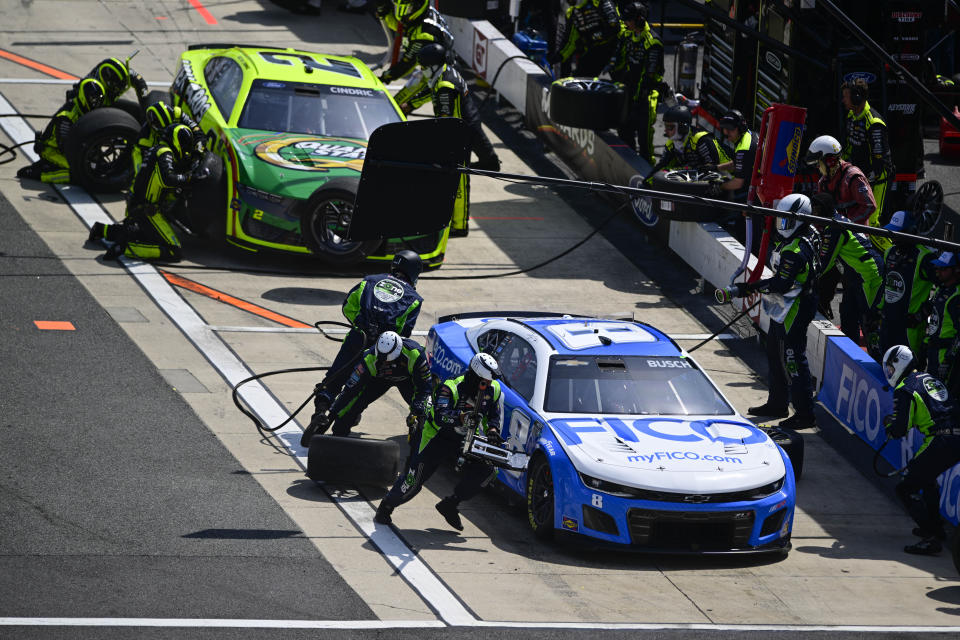 Kyle Busch (8) pits ahead of Austin Cindric (2) during a NASCAR Cup Series auto race at Dover Motor Speedway, Sunday, April 28, 2024, in Dover, Del. (AP Photo/Derik Hamilton)