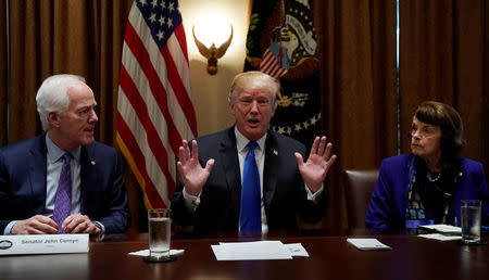 Flanked by Senators John Cornyn (R-TX) and Dianne Feinstein (D-CA) U.S. President Donald Trump meets with bi-partisan members of Congress to discuss school and community safety in the wake of the Florida school shootings at the White House in Washington, U.S., February 28, 2018. REUTERS/Kevin Lamarque