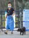 <p>Logan Browning and her pooch make a masked visit to a dog park in Los Angeles on Tuesday.</p>