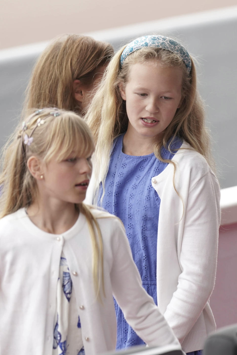 Isla Phillips, left, and Savannah Phillips during the Platinum Jubilee Pageant in London, Sunday June 5, 2022, on the last of four days of celebrations to mark the Platinum Jubilee. The pageant will be a carnival procession up The Mall featuring giant puppets and celebrities that will depict key moments from the Queen Elizabeth II’s seven decades on the throne. (Aaron Chown/Pool Photo via AP)