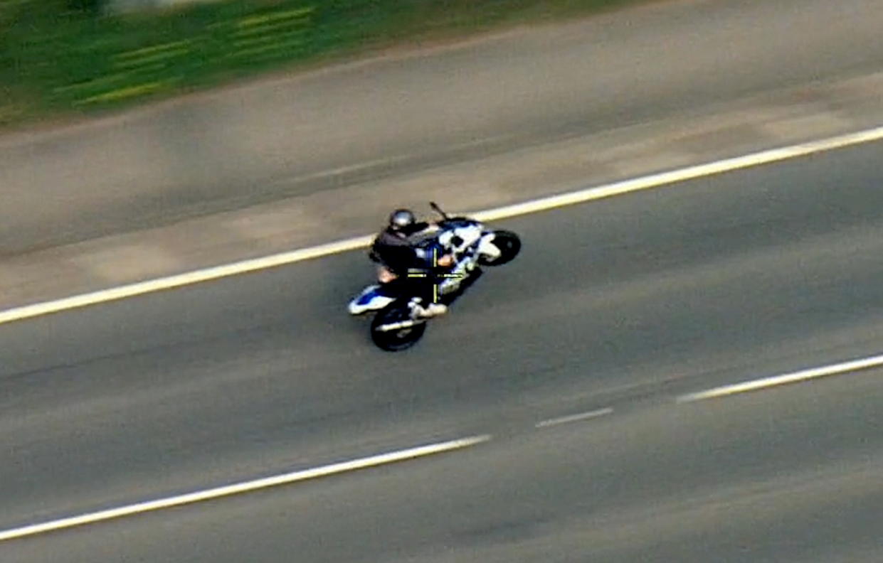 The speeding motorcyclist was filmed pulling wheelies before he was stopped. (Nottinghamshire Police / SWNS)