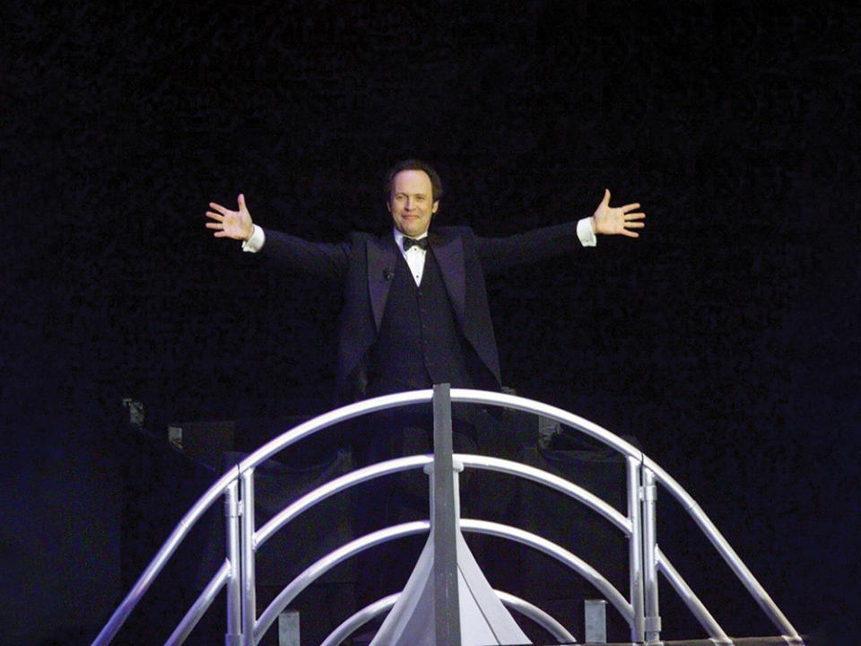 Billy Crystal on a mock Titanic during his opening monologue.