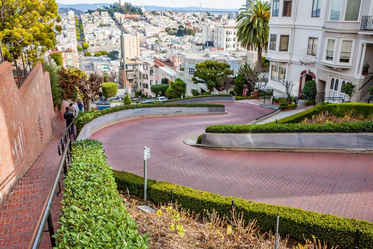 View from the Top of Lombard Street, San Francisco on hill with cityscape below in the distance