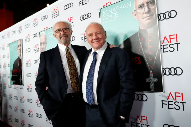 Cast members Pryce and Hopkins pose at a premiere for the film "The Two Popes" during AFI Fest 2019 in Los Angeles