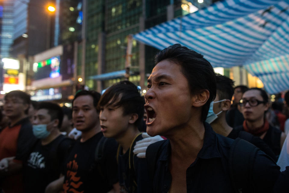 A pro-democracy activist screams at local residents and pro-government supporters as they protect their protest site on October 3, 2014 in Mong Kok, Hong Kong.  (Photo by Chris McGrath/Getty Images)